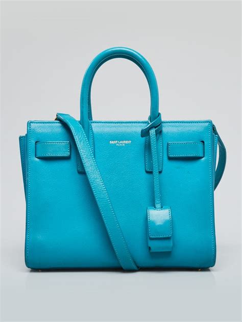 ysl turquoise clutch|YSL tuxedo bag.